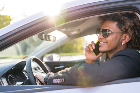 Side view photo of an african american elegant businessman talking to the mobile sitting inside a...