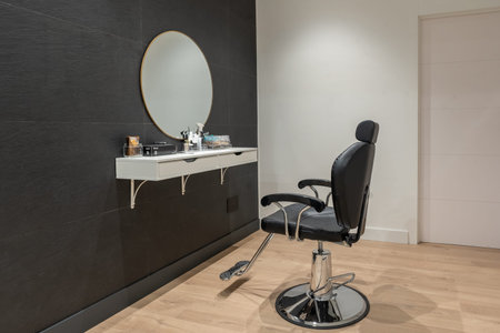 Interior minimalist space of a beauty salon with a chair and a mirrorの写真素材