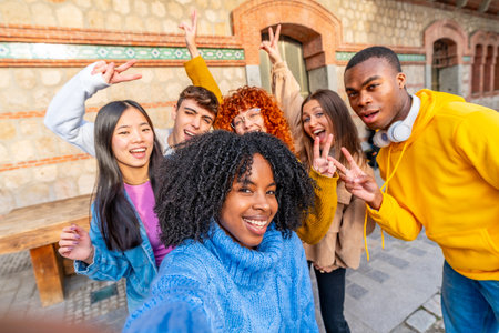 African girl and diverse friends taking a selfie in the cityの写真素材