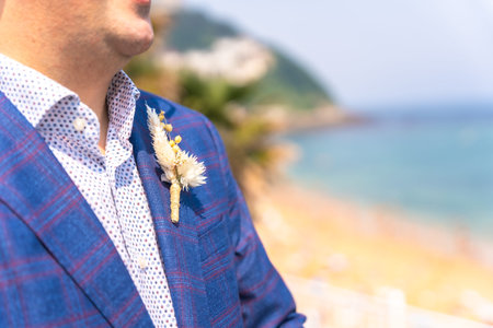 Detail of the groom's flowers in the pocket, lgbt concept of gay people at a wedding