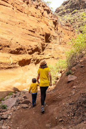 Family visiting the limestone canyon Barranco de las Vacas in Gran Canaria, Canary Islandsの写真素材