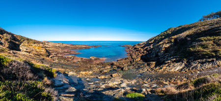 Panoramic view of the beautiful cove at low tide on Mount Jaizkibel next to San Sebastian, Gipuzkoa,...