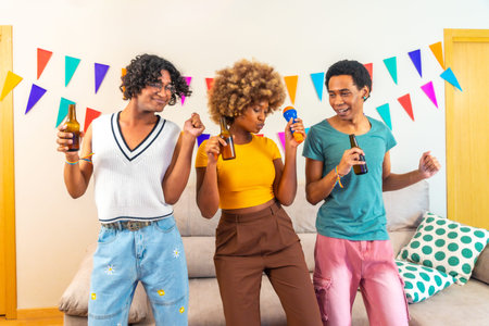 Three quarter length photo of a group of female and male multi-ethnic friends singing karaoke and...