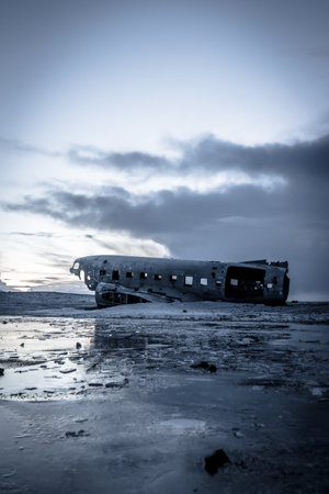 Plane crashed on frozen Solheimasandur beach in winter with snow in Icelandの写真素材