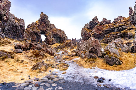 Frozen rock formations ice and snow on Djupalonssandur beach on Snaefellsnes peninsula in winter Icelandの写真素材