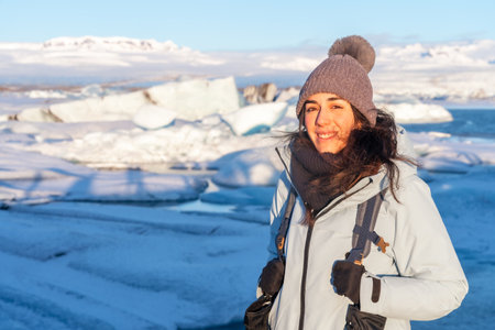 Portrait of a woman on the frozen iceberg lake of Jokulsarlon. Icelandの写真素材