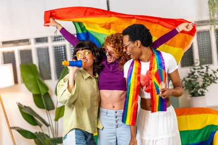 Transgender person and lesbian couple singing karaoke at homeの写真素材
