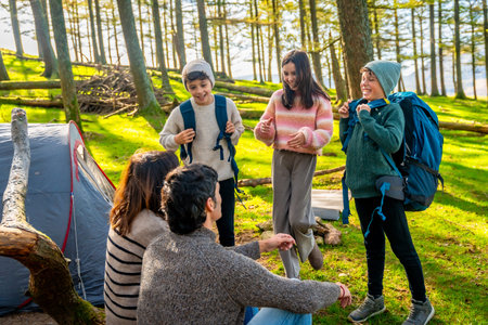 Caucasian family during a meeting at camping weekend in the forest