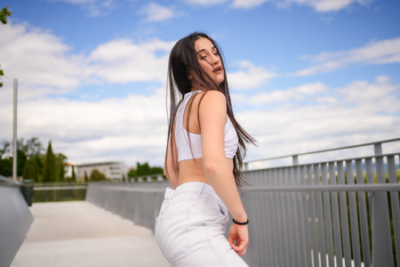 Side view of an energetic young woman dancing sensually urban music outdoorsの写真素材