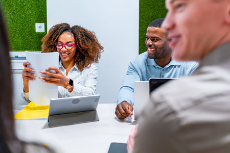Business people collaborating on a project, sharing ideas and working together in a modern coworking...