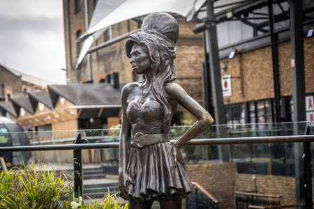 Bronze statue of the late singer Amy Winehouse, standing proudly in stables market, Camden Town, Londonの写真素材