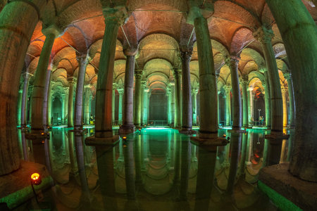 Ancient underground water reservoir with many columns reflecting on the water surface and...