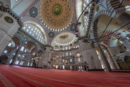 Wide angle view of the Suleymaniye Mosque interior in Istanbul, Turkey, showing the vastness of the...