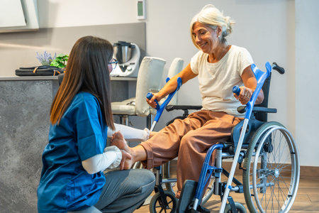 Nursing professional administering physical therapy to an elderly woman in a wheelchair, focusing on...