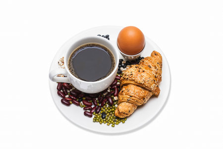 Homemade croissants and black coffee on white background