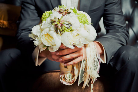 Groom with wedding bouquetの写真素材