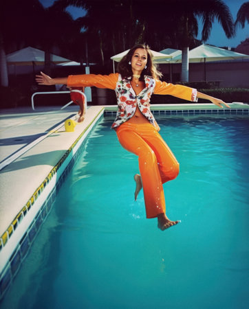 Summer vivid color concept, a young beautiful girl who jumps into the pool during a crazy summer party. Generative AI.の素材