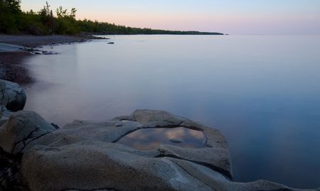 Bowl of clouds in a stone on the North Shore of Lake Superior at Stoney Point in Minnesotaの写真素材