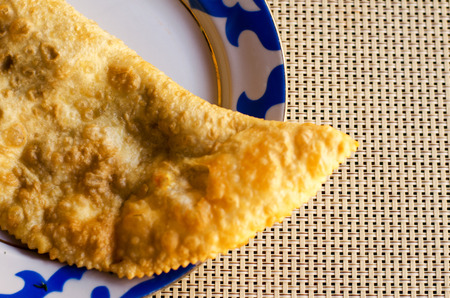 Cheburek on a plate with blue borderの写真素材