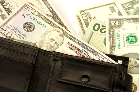Money in  wallet. On a white background. Isolated.