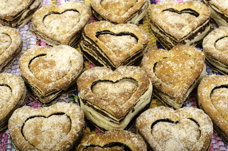 Cookies in shape of  heart on multi-colored matting.の写真素材