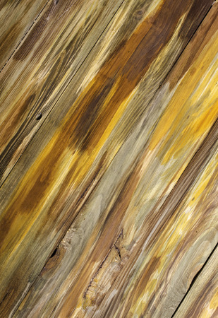 Wooden light brown diagonal background with pattern and  cracks.の写真素材