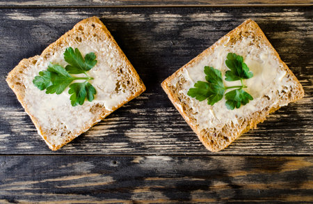 Sandwich with butter and parsley.の写真素材
