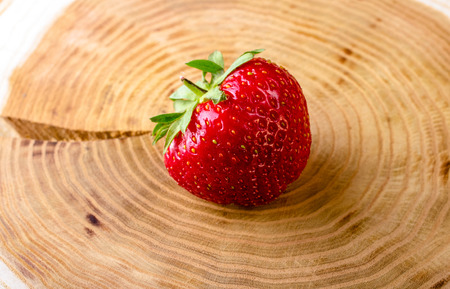Strawberries on a light stump. Close-up.の写真素材