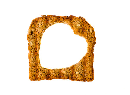 Delicious toast with a hole in the form of heart. Isolated.の写真素材