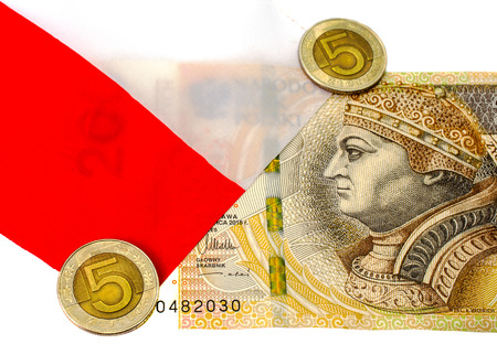 Denomination  200 zlotys and coins 5 zloty against the backdrop of the Polish flag.の写真素材