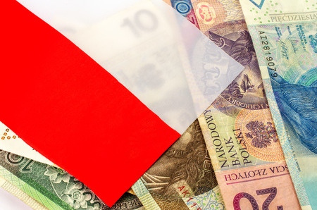 Polish zloty. Many banknotes of different denomination and the polish flag.の写真素材