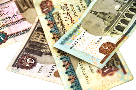 Paper money. Banknotes of Egyptian pounds on white background. Isolated. Selective focus. Close-up.の写真素材