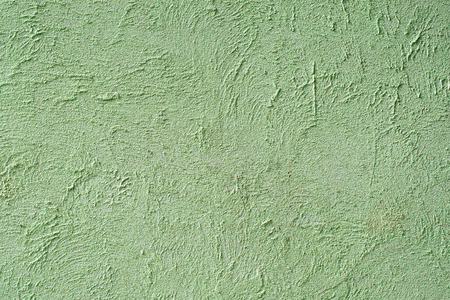 Light plaster wall with dirty scratched texture. Cracked rough abstract banner surface.  Backdrop for design. Abstract background. Close-up.の写真素材