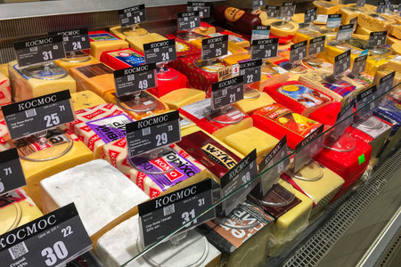 Kiev, Ukraine, January 2020: - Many choice of delicious hard cheese variety in the food counter of...
