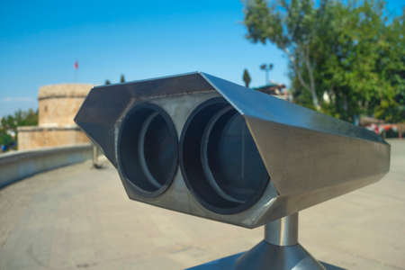 Close-up view of tourist binoculars. Binoculars telescope on the observation deck for tourists. Shallow depth of fieldの写真素材