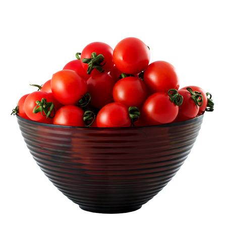 cupful of tomatoes isolated white backgroundの写真素材