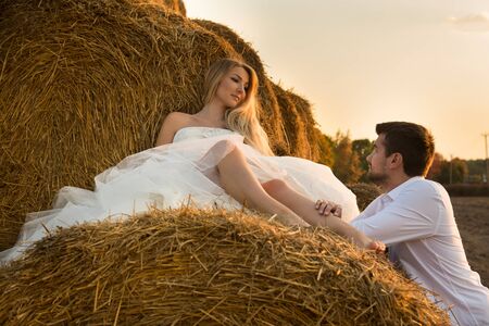 in the evening the bride and groom in the hayloftの写真素材