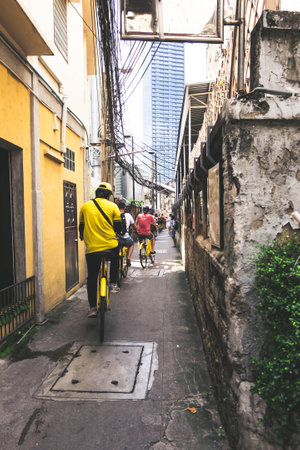 Ride a row of tourist bikes into the alley.の写真素材