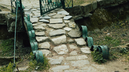 Small stone and wrought iron bridge