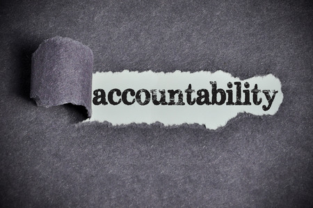 accountability  word under torn black sugar paperの写真素材