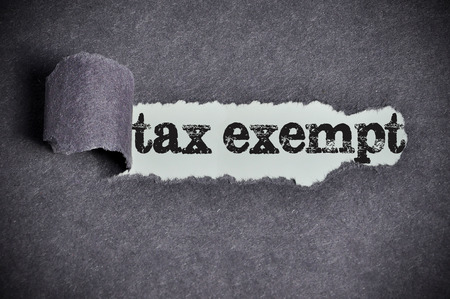tax exempt  word under torn black sugar paperの写真素材