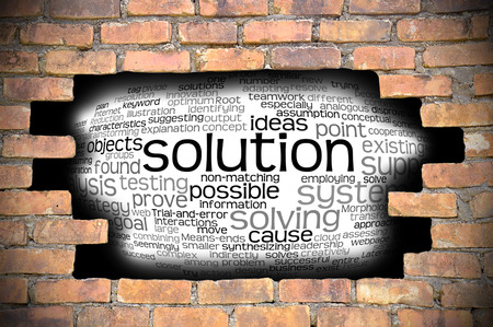 Business Concept  Hole in The Brick Wall Fill With Word Cloud Of Solution And Its Related Words.の写真素材