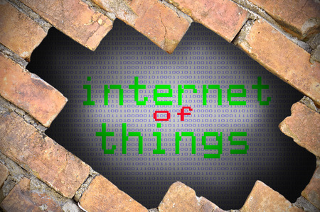 Hole In Brick Wall With internet of things Word.の写真素材