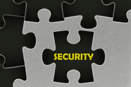 The white jigsaw puzzle written word security.の写真素材