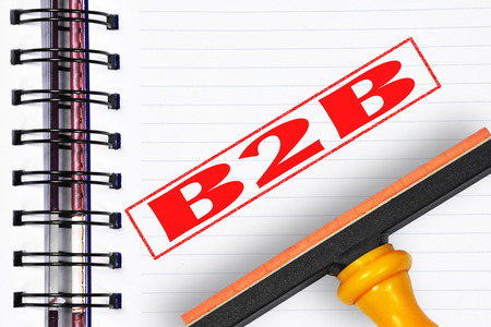 Business to business (B2B) rubber stamp on the note book.の写真素材