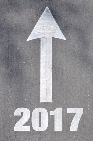 Arrow on asphalt road written word 2017  .の写真素材