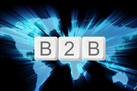 Business to business (B2B) keyboard button with world background.の写真素材