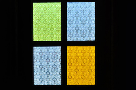 traditional window of malay house illuminate by the bright sun outside the house..の写真素材