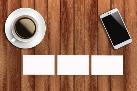 Top view flat lay blank business card, coffee and smart phone with copyspace area.の写真素材