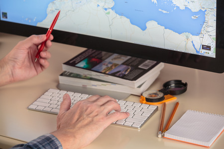 Planning and preparation of travel with computer via internetの写真素材